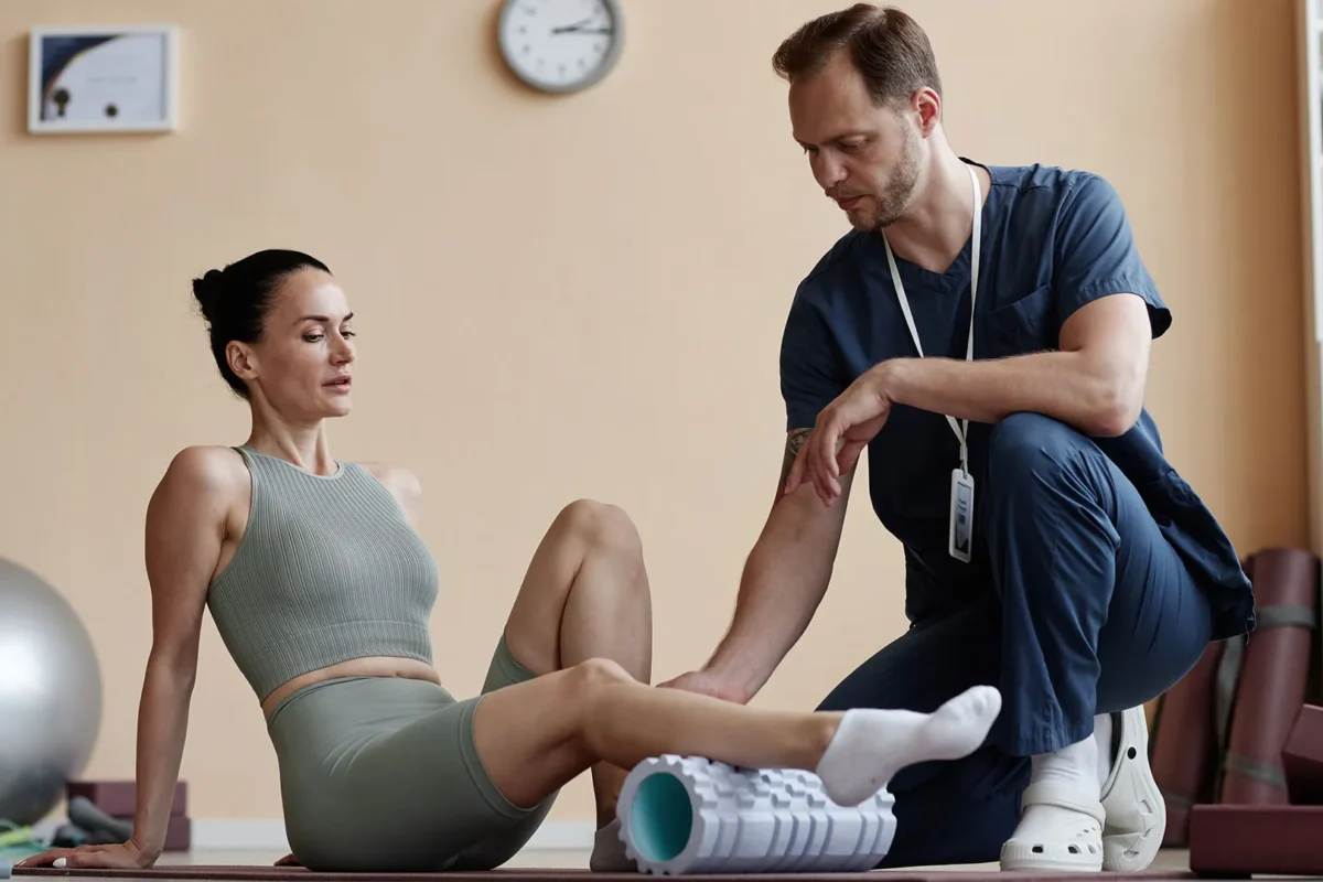 Rehabilitation exercise for the leg muscles with a foam roller